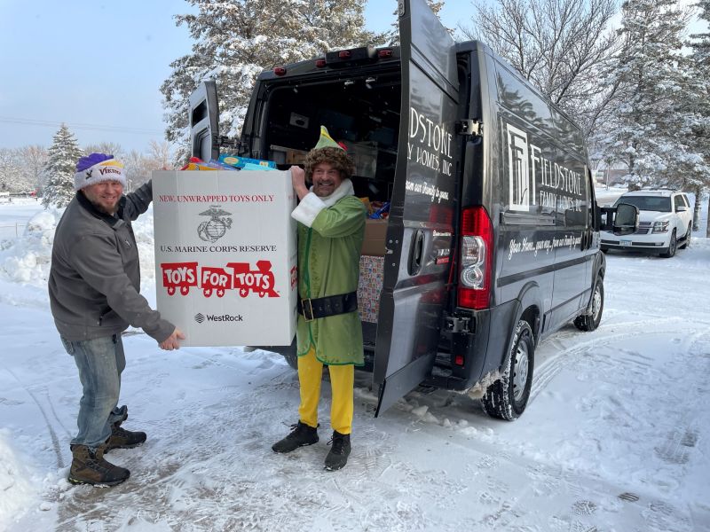 Fieldstone "elfs" load toys into the van to donate to Toys for Tots