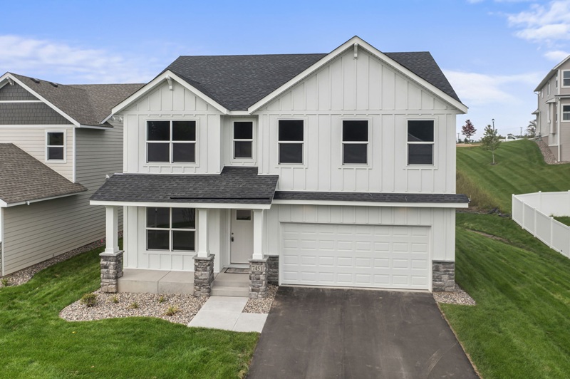 White exterior home with two-car garage