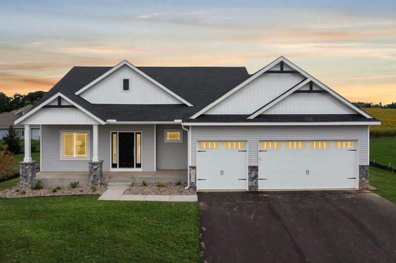 White with black accent home and 3-car garage